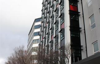 On top and next door to government