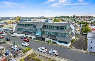 Versatile multi-use building with holding income