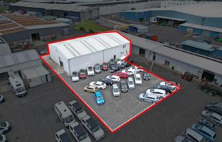 PROMINENT WAREHOUSE AND YARD
