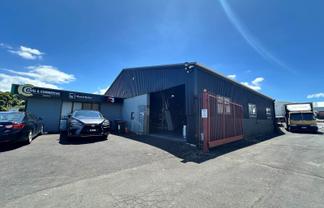 TWO WAREHOUSES, SHOWROOM, AND LARGE YARD
