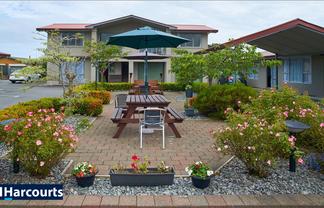 Be Charmed By This Motel Opportunity!