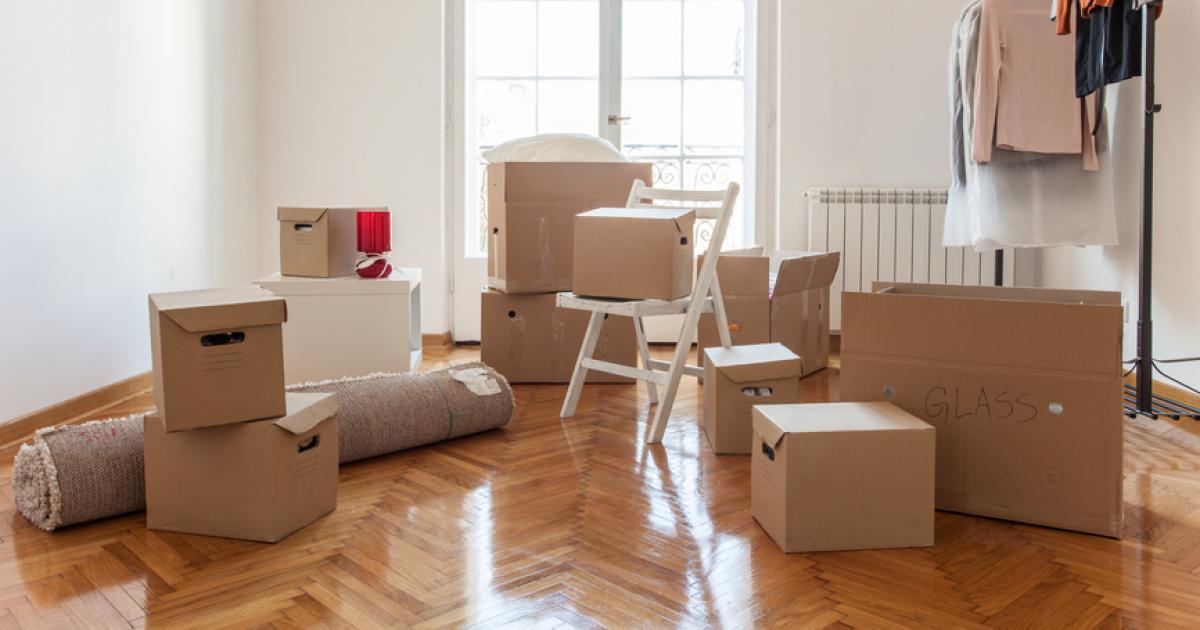 Moving out boxes packed as home seller lists property on the market